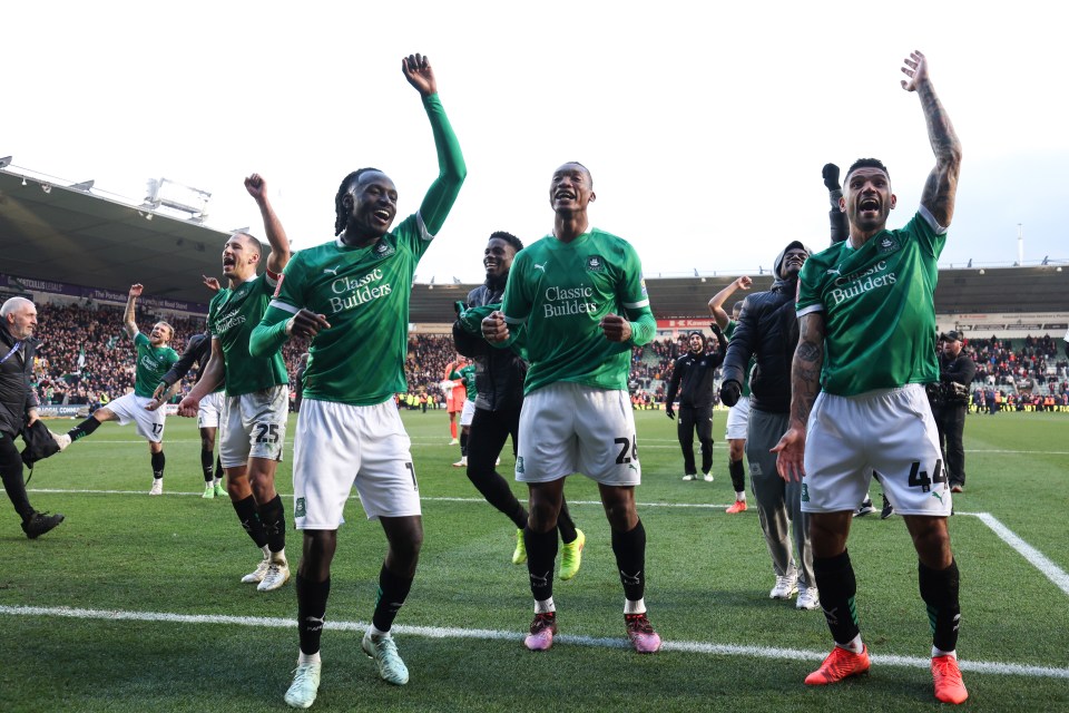 Plymouth Argyle players celebrating a victory.