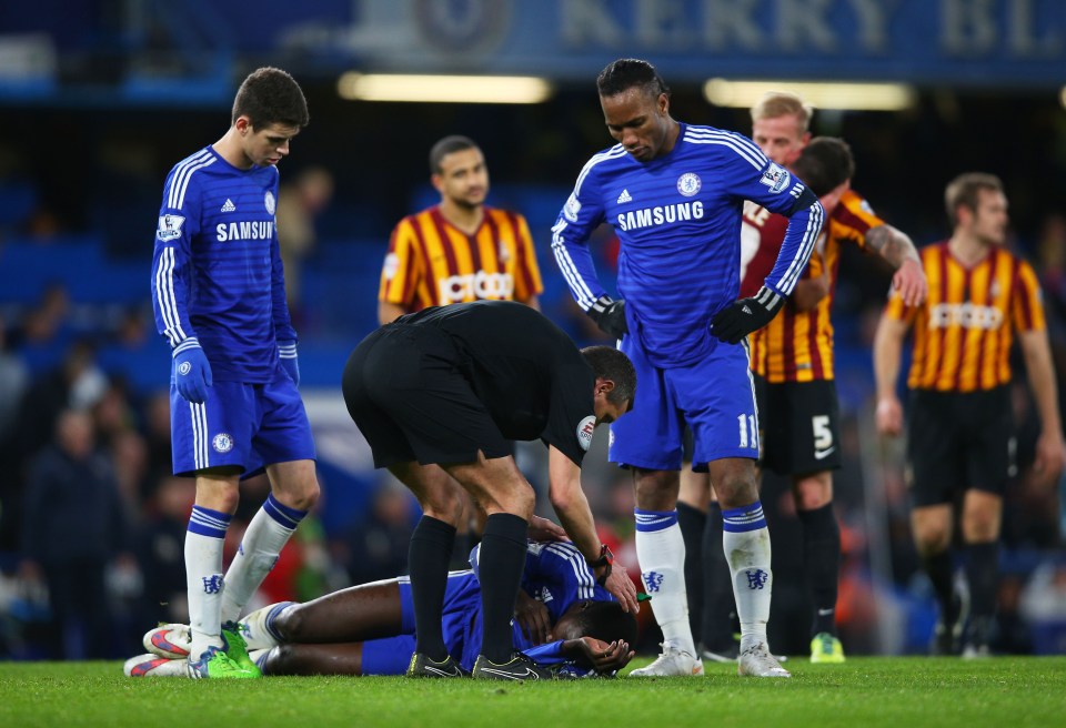 Soccer player receiving medical attention on the field.