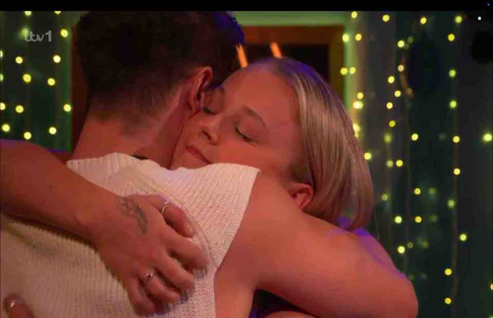 Two people embracing.