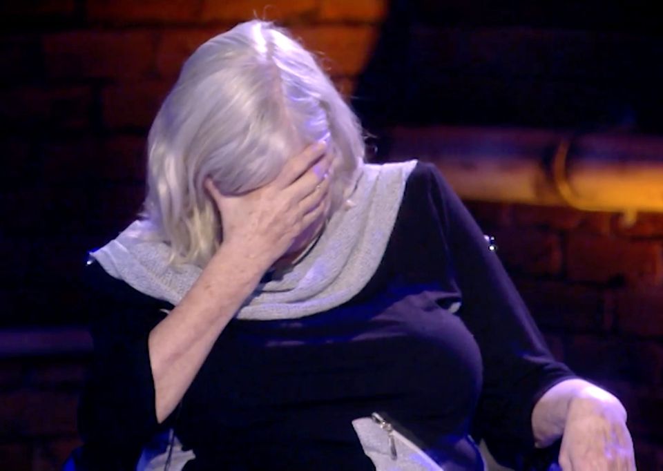 Ann Widdecombe on Celebrity Big Brother, covering her face with her hand.