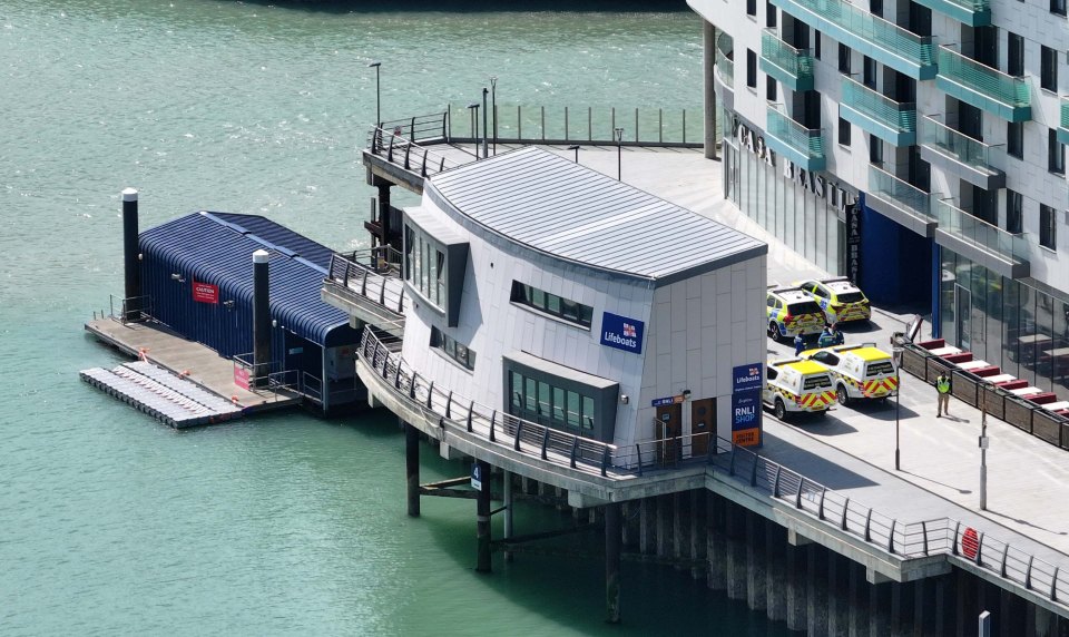 Brighton lifeboat station with police vehicles.