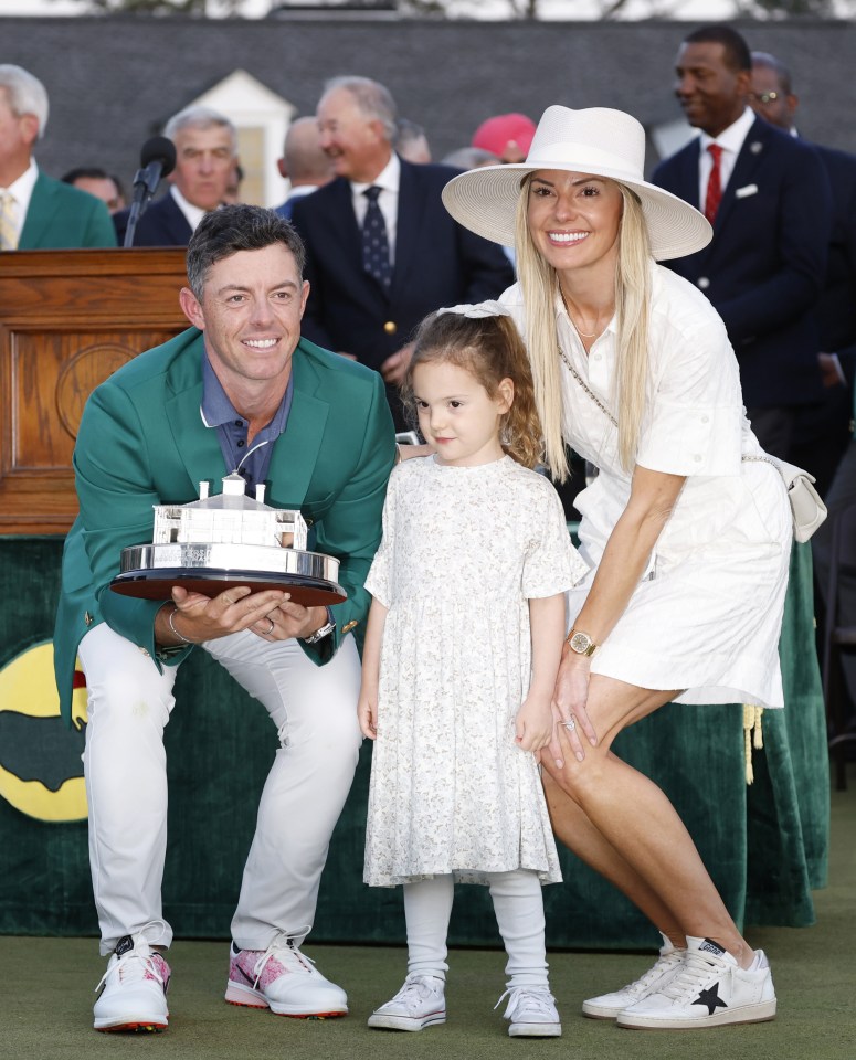 Rory McIlroy with his wife and daughter after winning the Masters Tournament.