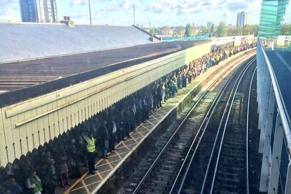 Commuters crowding a platform at Clapham Junction 