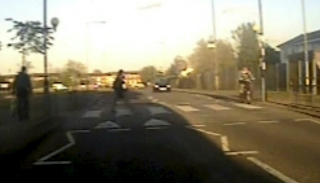 The woman was crossing the road when the black KA struck her