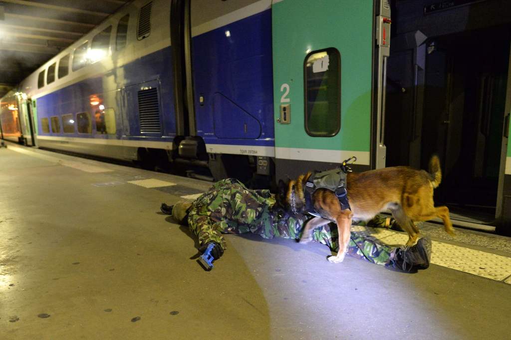 The hostages were guarded on board the train by the terrorists
