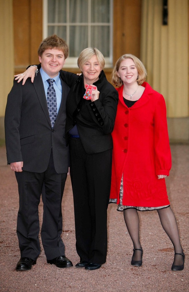 Wood pictured at Buckingham Palace after recieving her CBE for services to Entertainment with her son Henry Durham and daughter Grace Durham in 2008