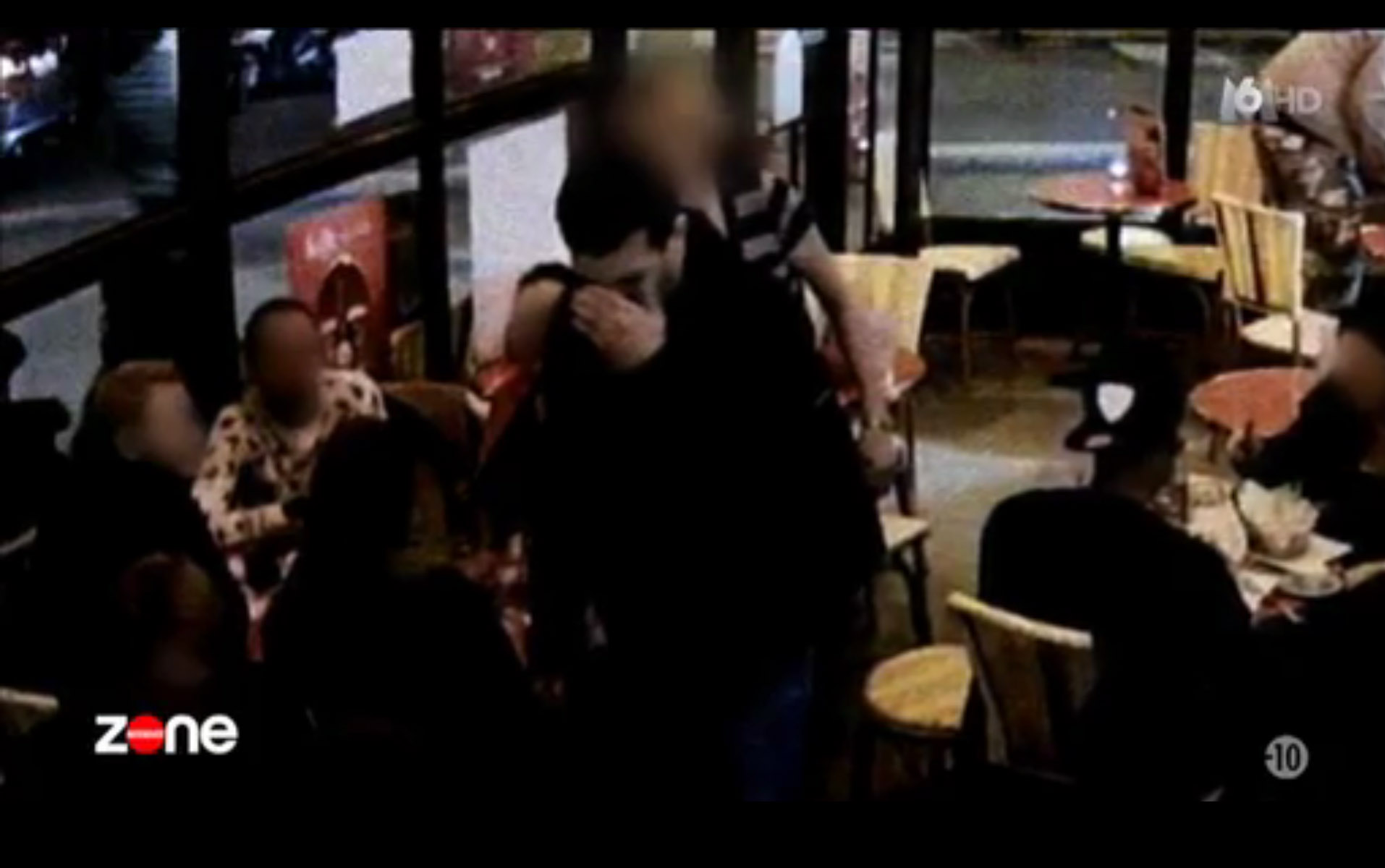Moments before attack ... Abdeslam is seen covering his head before detonating belt without warning
