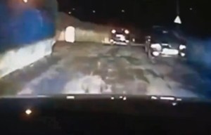 Dramatic moment danger driver is rammed off the road and into a freezing river during high-speed chase