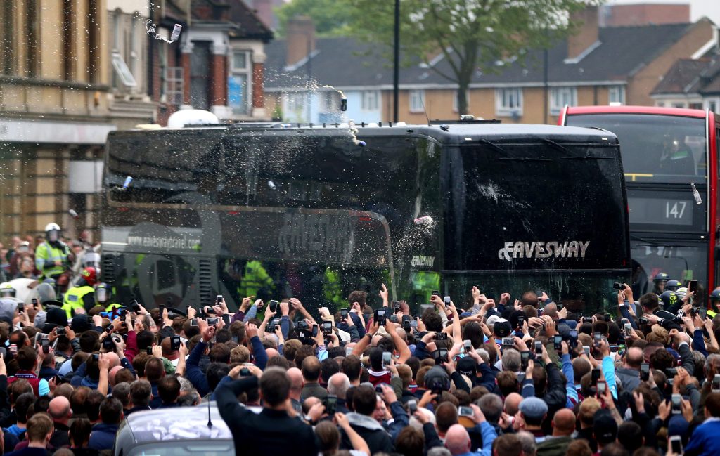 Windows were smashed when bottles were thrown at the bus
