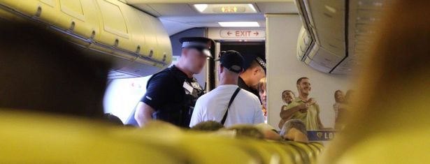 Cops remonstrated with the stag before carting him off the Spain bound flight in front of shocke passengers