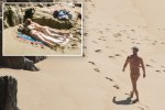 Bumming around...Some Brits wasted no time in stripping off to catch some sun as this week's good weather continued yesterday