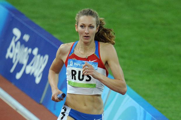 Russia's Tatiana Firova approaches the finish line to win the women's 4x400m Relay heats at Beijing 2008