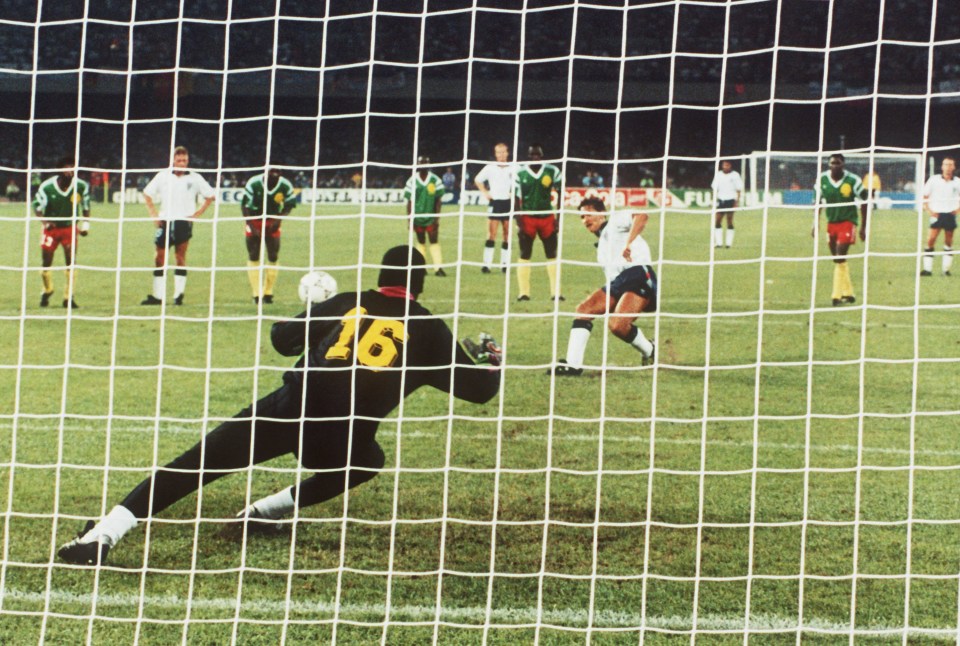 England's Gary Lineker scores from the penalty spot past Cameroon goalkeeper Thomas N'Kono during the England v Cameroon 1990 World Cup Quarter Final match.