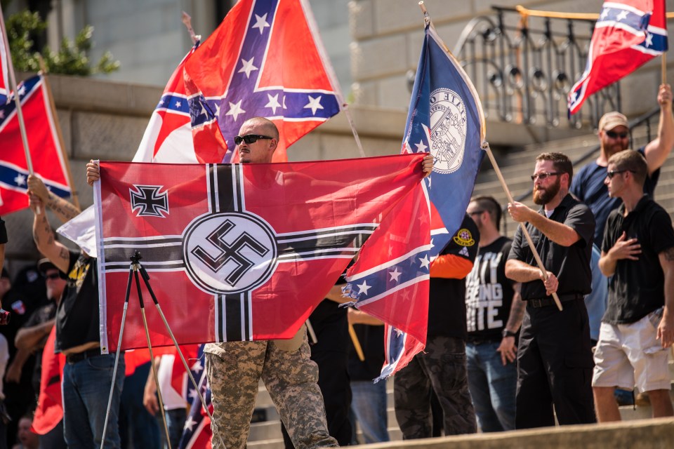 The Klu Klux Klan wave swastikas, which is an emblem of the neo-Nazi movement
