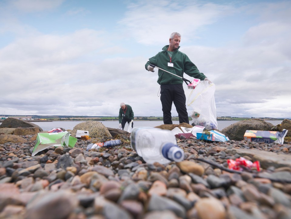 Environmentalist cleaning up beach