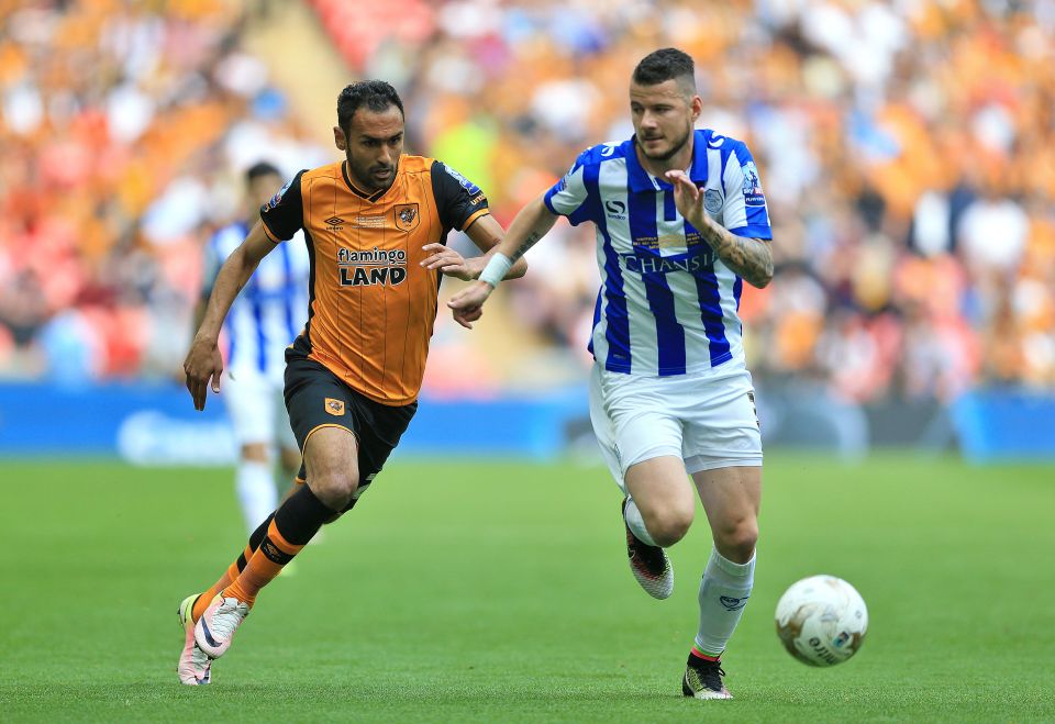 Sheffield Wednesday's Daniel Pudil fends off Hull's Ahmed Elmohamady during the Championship Play-Off final - which Hullm won 1-0