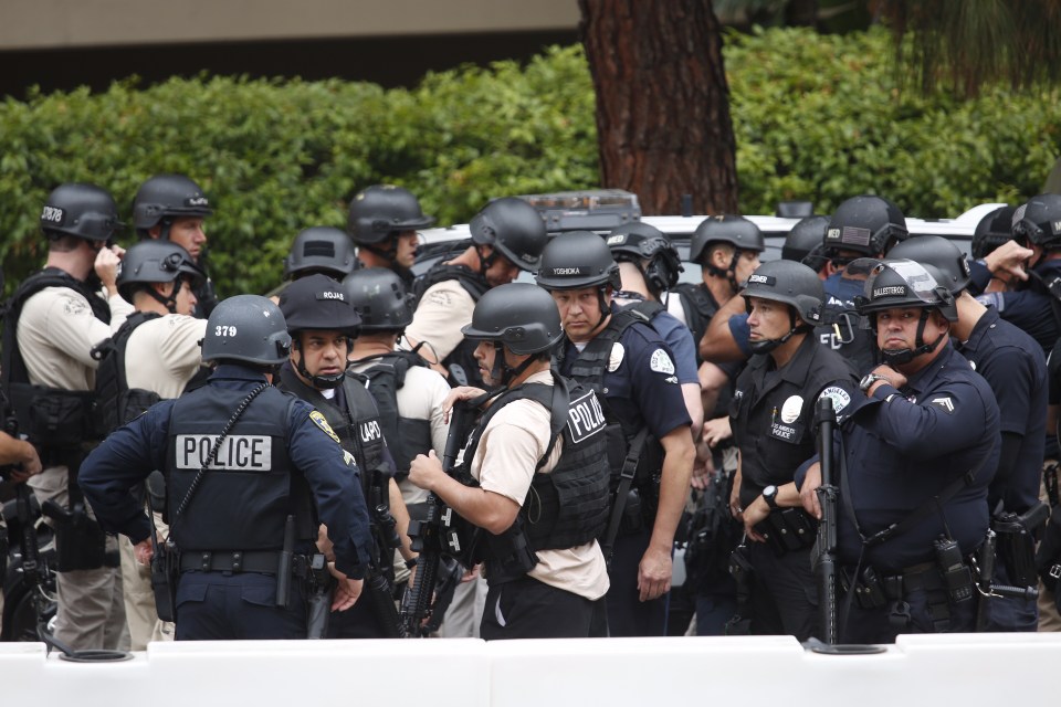 Hundreds of armed officers gather to track down the gunman