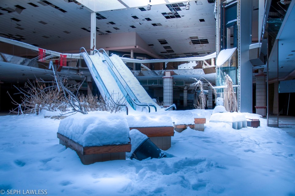 One spooky mall was untouched but for the foot of snow that had fallen through the roof and settled on the floor