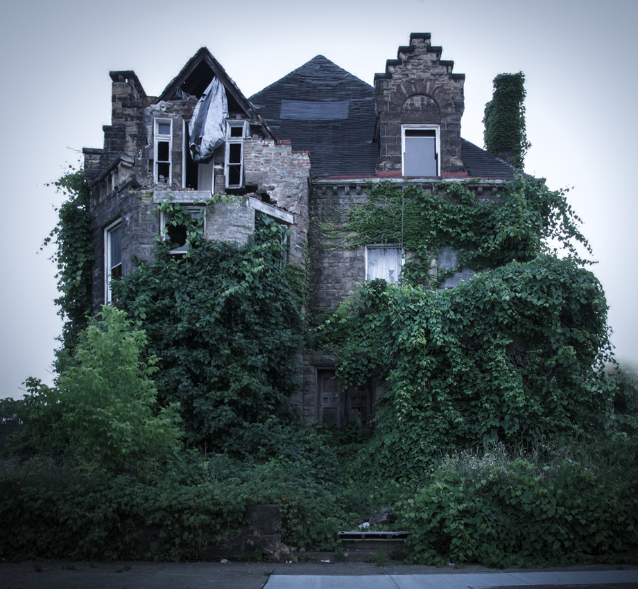 Rather grander accommodation stands empty as plants creep up its wall to cover the windows