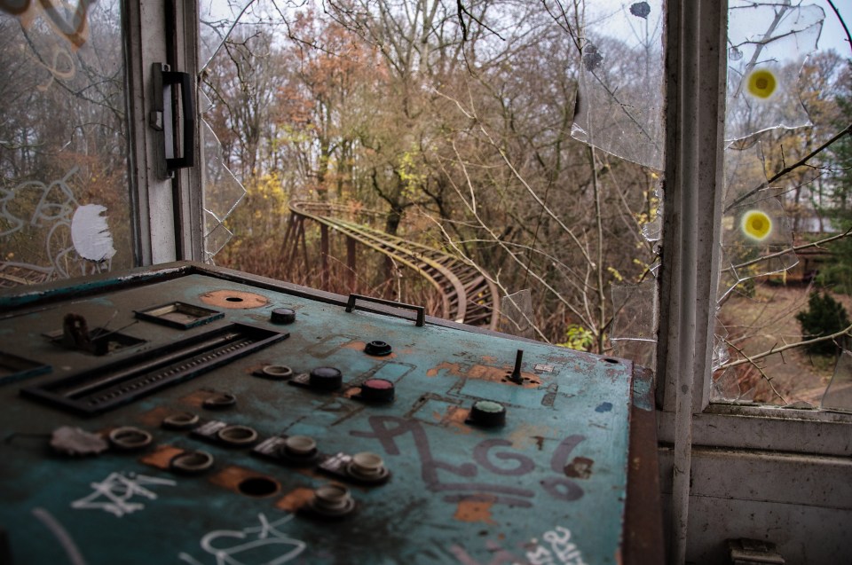 Controls for the rides sit in a room overlooking where a rollercoaster would once have passed by