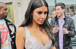 Kim Kardashian wore a very plunging dress as she went to the theatre with her family