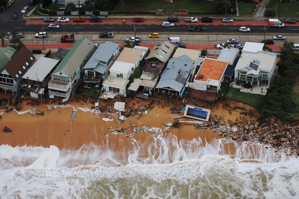 A luxury row of houses on Collaroy beach north of Sydney risks being swept into the sea by the huge waves