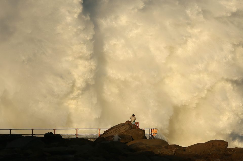 Some onlookers got too close to the waves, which reached heights of up to eight metres. One man was swept away from rocks by Bondi Beach