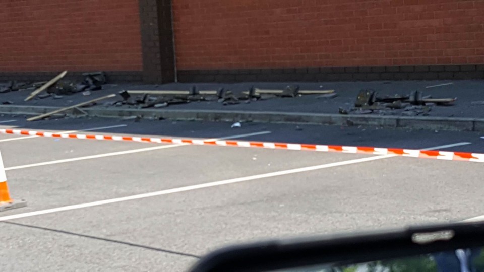 Pictured: The roof panels lying outside the Aldi store where Melanie was injured