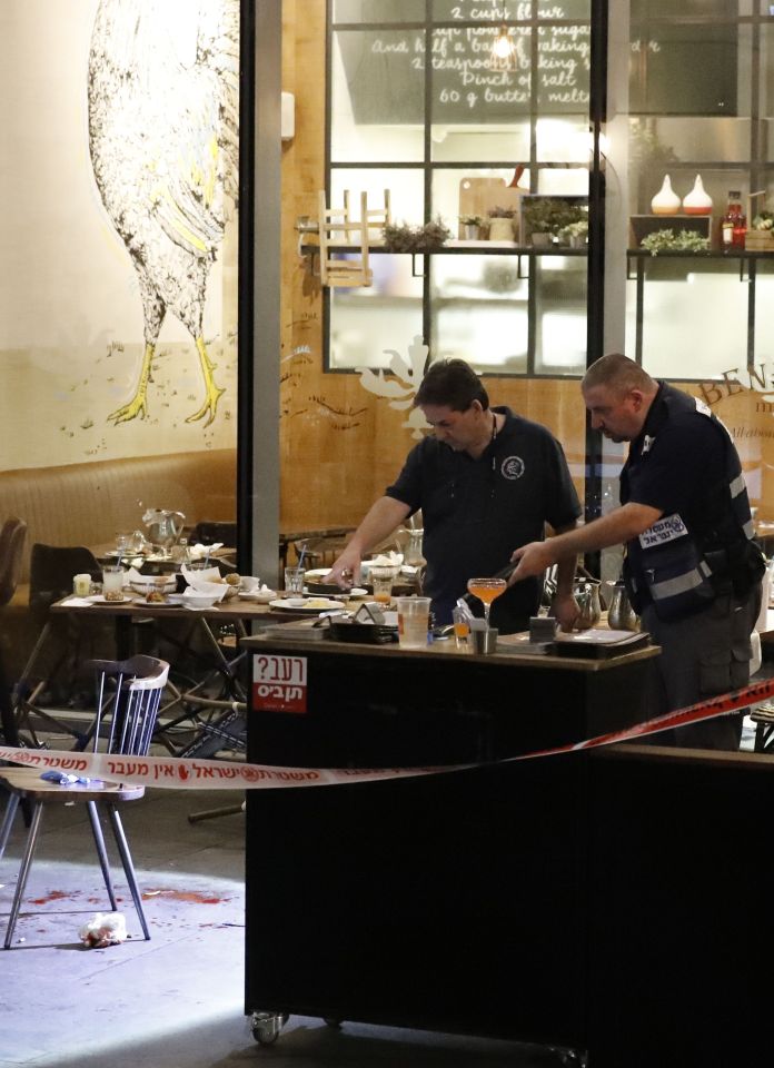 Israeli security forces inspect the site