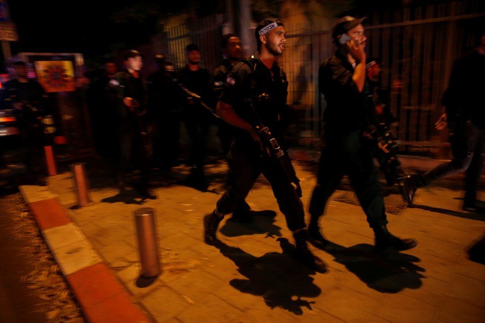 Israel security personnel search the area following a shooting attack that took place in the center of Tel Aviv