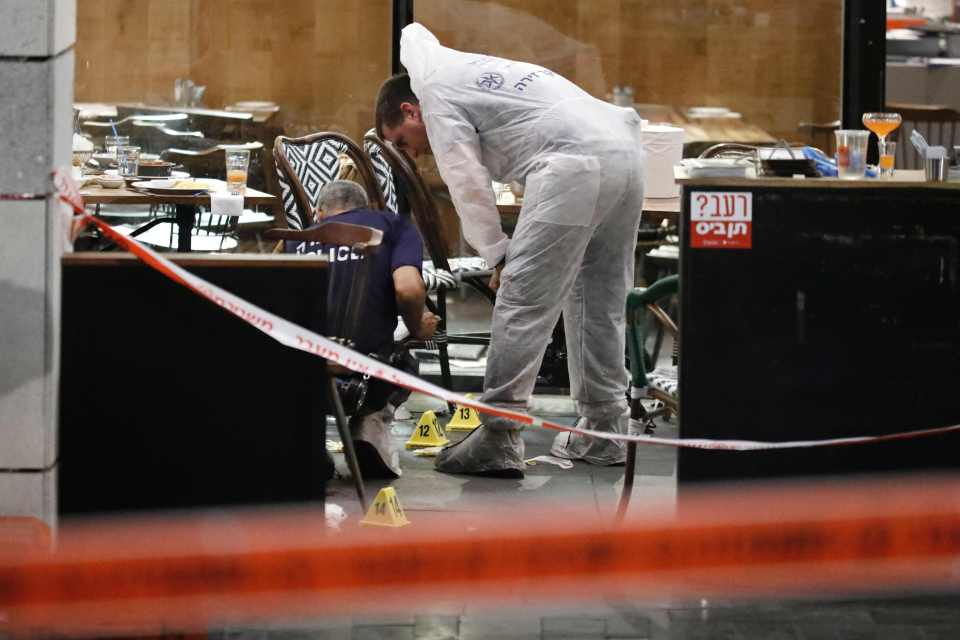 Israeli forensic police inspect a restau