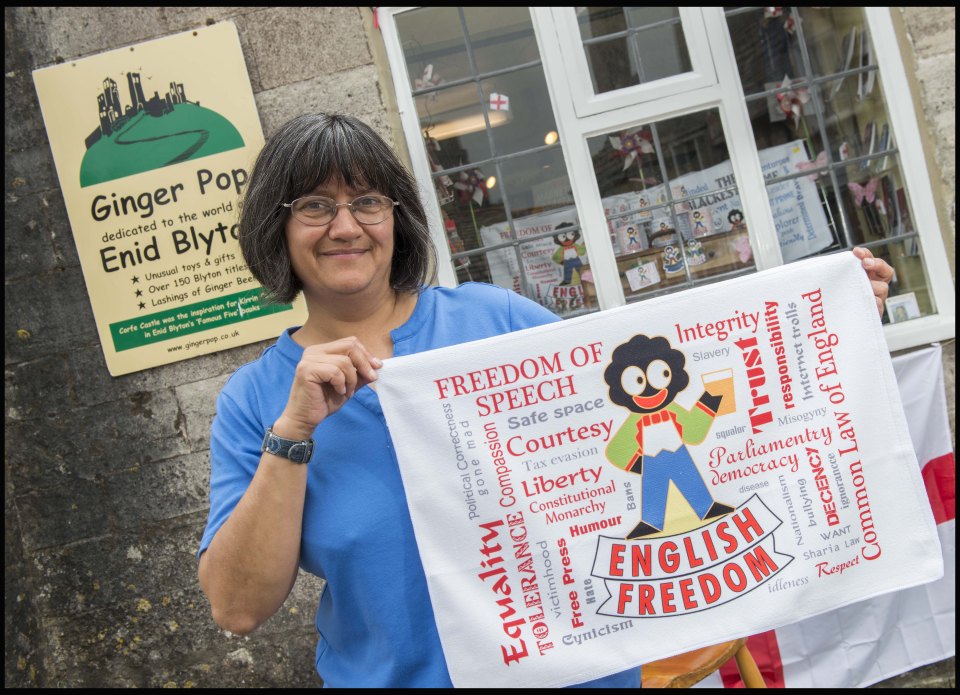 Shop owner Viv Endecott's window dressing was banned from the local arts festival for its use of golliwogs