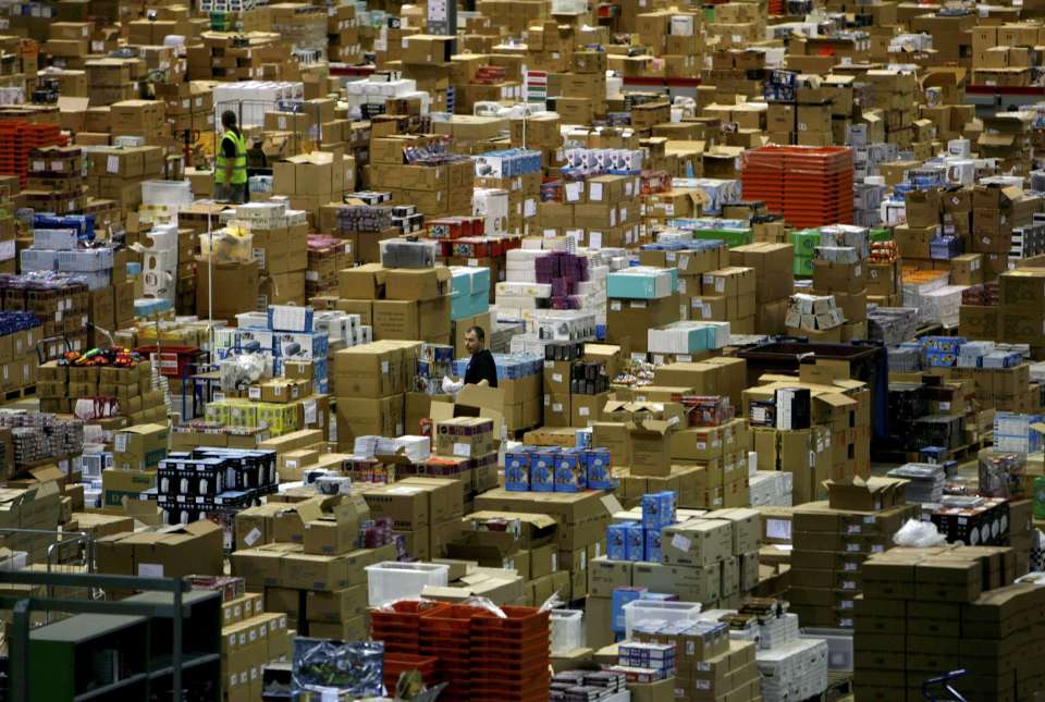 Workers are seen in the Amazon.co.uk warehouse in Milton Keynes, north of London