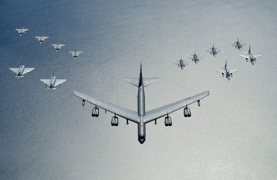 The warning comes as the US showed off its incredible military prowess as a B-52 bomber flies in formation with a dozen fighter jets over the Baltic