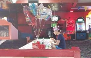 This photo of a teen girl with autism celebrating her 18th birthday alone will break your heart