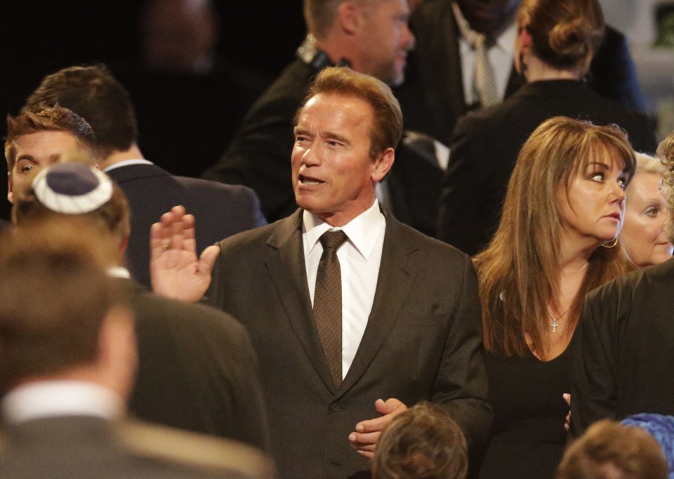 Former Governor of California Arnold Schwarzenegger, center, arrives for Muhammad Ali's memorial service, Friday, June 10, 2016, in Louisville