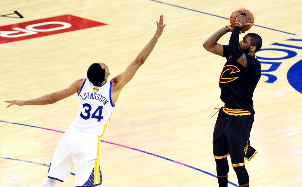 Cleveland Cavaliers guard Kyrie Irving (2) shoots the ball against Golden State Warriors guard Shaun Livingston (34) during the second quarter in game five of the NBA Finals