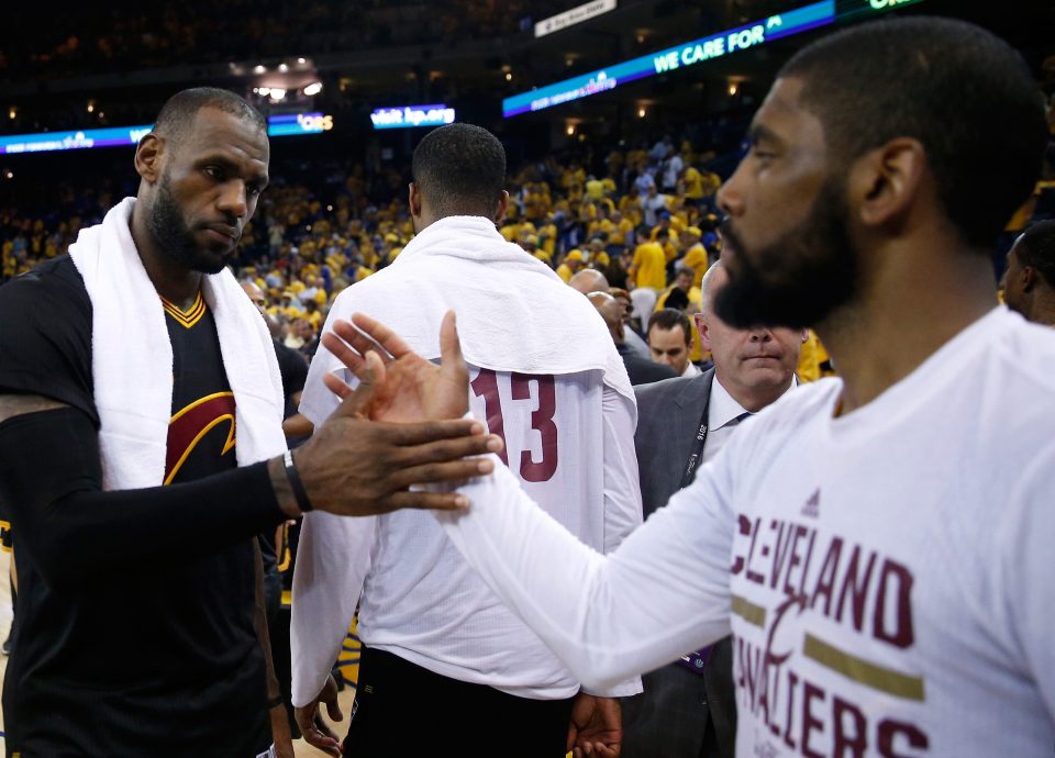 Cleveland Cavaliers pair LeBron James and Kyrie Irving shake hands at full-time of the NBA Finals
