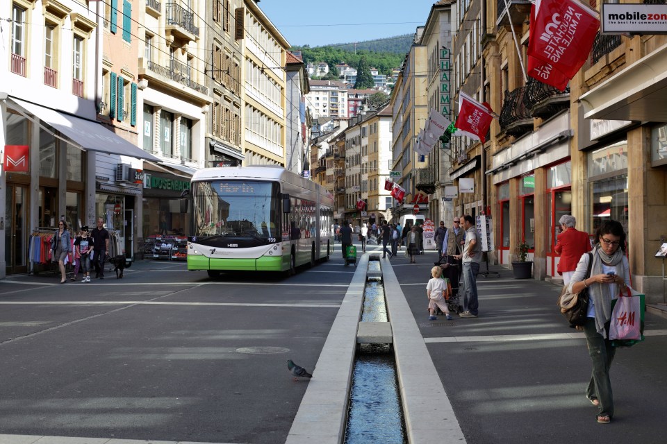 A modern trolleybus in the otherwise pedestrianised Rue du Seyon, in the centre of Neuchatel, Switzerland.
