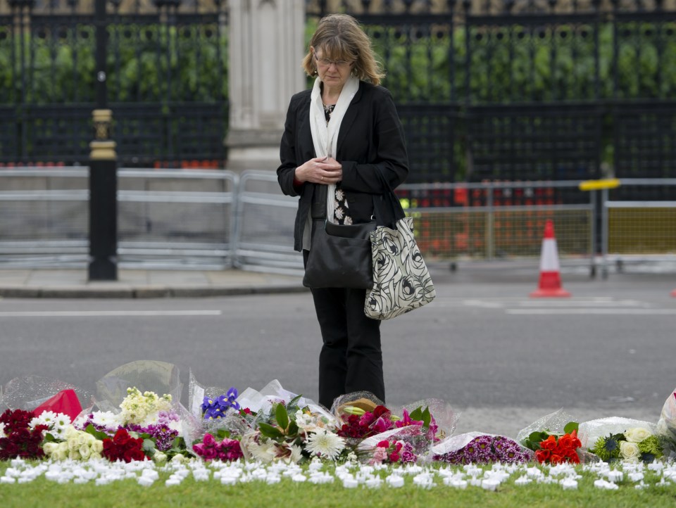 People leave tributes to Jo Cox in Parliament Square