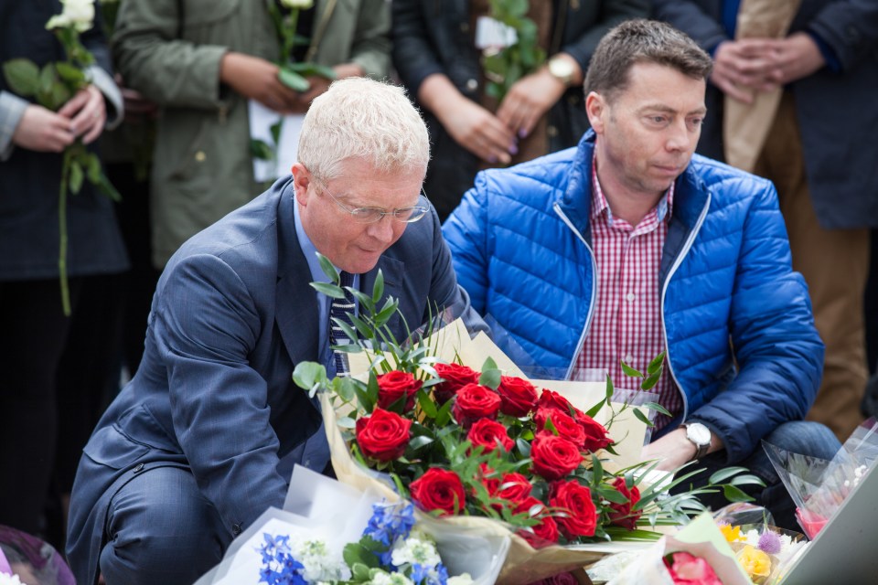 John Cryer MP, chair of the Parliamentary Labour Party, and Iain McNicol, general secretary of the Labour Party, lay flowers in Parliament Square