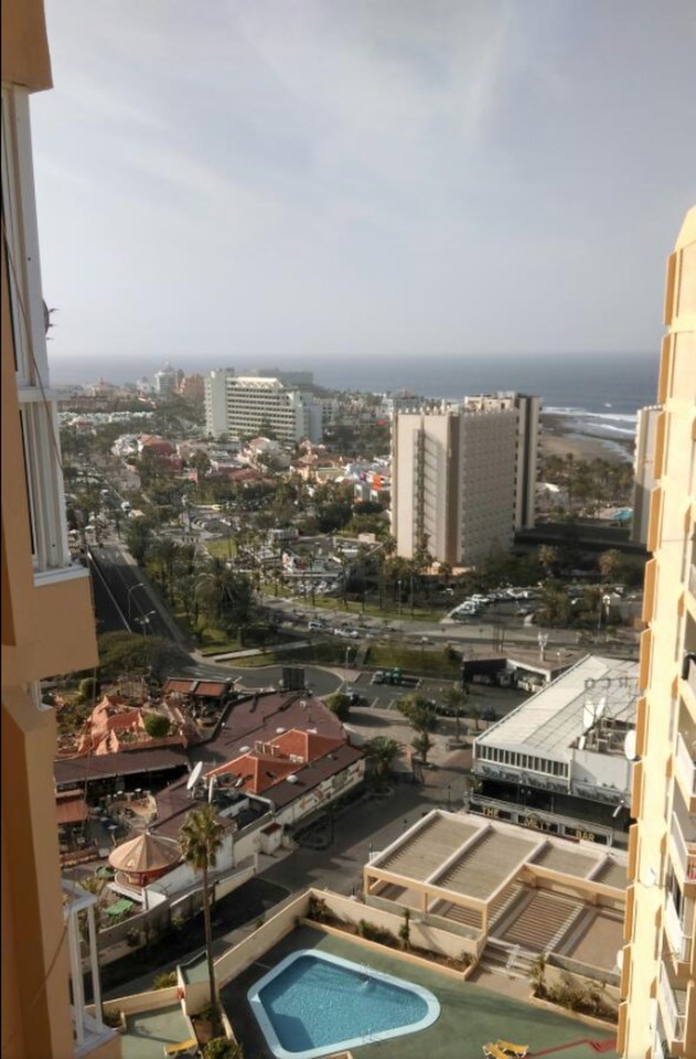 A 22 Yr old Irish woman has died after falling from Tower block of apartments balcony whilst on holiday in Tenerife.