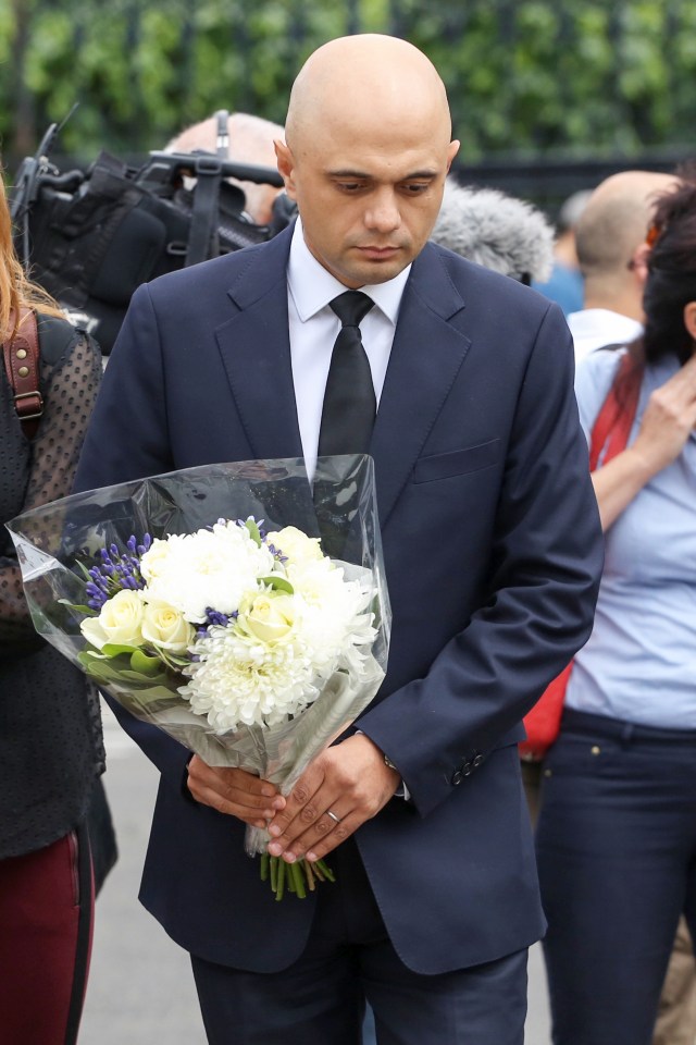 Tory Business Secretary Sajid Javid lays flowers at the vigil for Jo Cox by the Houses of Parliament