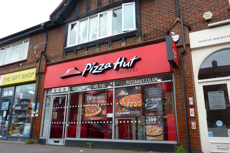 The 17-year-old girl was dragged from this Pizza Hut on Waterloo Road, Epsom, Surrey