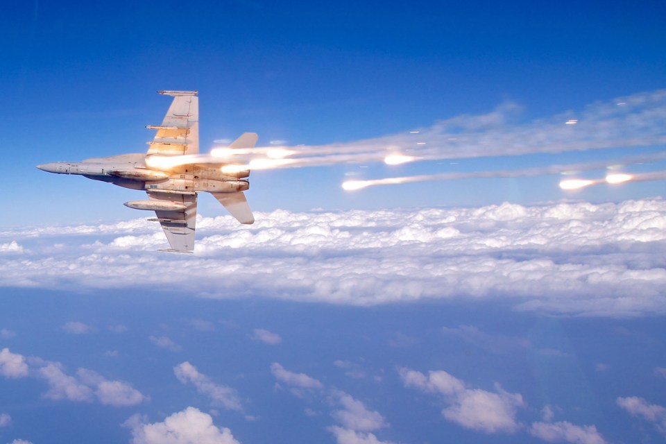 US F/A-18 fighters (pictured) came face to face with Russian SU-34s after a Syrian garrison was bombed