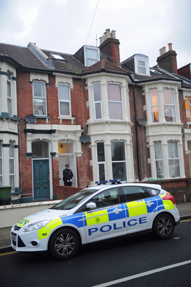 Police outside the house where a 27-year-old man was hacked to death