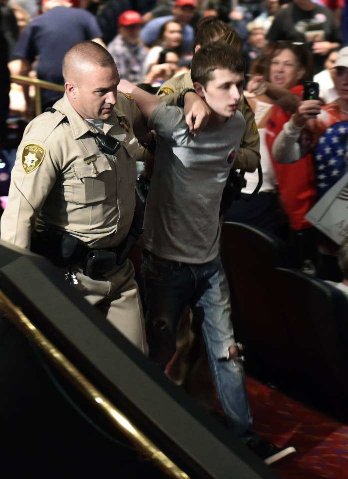 Sandford was led away by police with Trump telling the rally "we love our police"