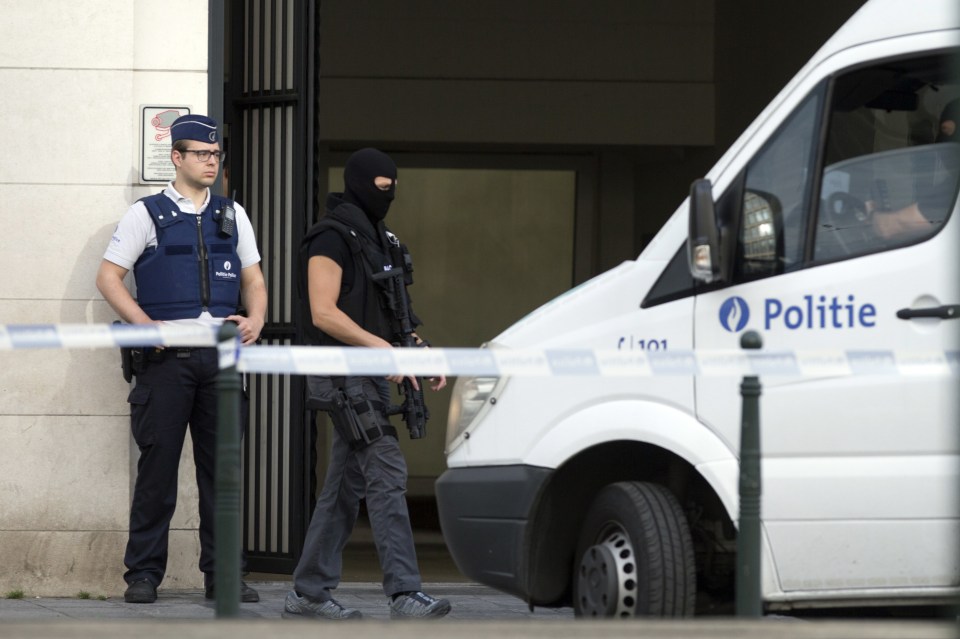 Police patrol as a van arrives for a court hearing for suspect Mohamed Abrini at the Court of Appeals in Brussels on Thursday, June 23, 2016. A Brussels appeals court panel met Thursday to consider France's extradition request for Mohamed Abrini, 31, a suspect in the Paris and Brussels attacks that were claimed by the Islamic State organization. (AP Photo/Virginia Mayo)