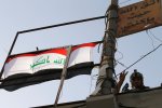 A member of Iraqi counterterrorism forces gestures in Falluja