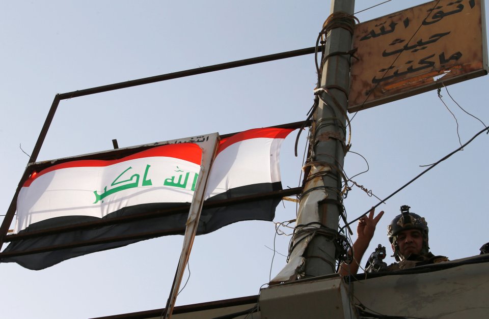 A member of Iraqi counterterrorism forces gestures in Falluja